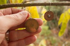 Meditatively hand stamped pure copper discs dangle from hand formed sterling silver ear hooks with a hand formed sterling silver center. Total length is 1 3/4 inches. Rustic and rhythmically styled showing the unique quality of a handmade original. A patina has been added bring depth to the stamped design and add to the rustic style.. I find these have a nice thickness to them and a good weight- each earring weights approximately .10 oz (3g) Ladybug Jewelry, Rain Earrings, Jewelry Rustic, Mandala Jewelry, Mandala Earrings, Stamped Earrings, Rustic Earrings, Beach Earrings, Rustic Jewelry