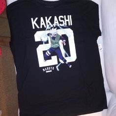 Black With Logo Kakashi Casual Black Shirt For Fan Merchandise, Black Shirt With Front Print For Fan Merchandise, Black Shirt With Front Print For Fans, Rose T Shirt, White Halter Maxi Dress, Green Shorts, Blue Shorts, Vintage Skirt, Tshirt Logo