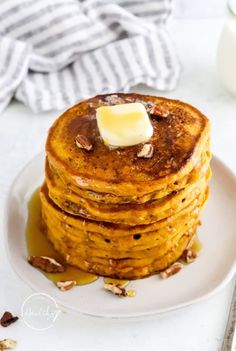 a stack of pancakes with butter on top