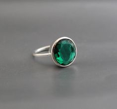 ♦♦ Beautiful handcrafted ring  ◘Stone Information:     Green Quartz ) -     Color: Green     Cut:  Round ◘ Metal: 925 Sterling Silver ◘ Band: 1.5 mm  ◘ Setting: Open back bezel setting ◘ Finish: High polish  ◘ Nickel free  ◘ Handmade band: 14 gauge solid sterling wire    This ring is adorably rustic, easy to wear, & stackable! ◘Please Note - The Ring in the Picture can be available or  Sold out. Every  Ring is Made of a     Unique Gemstone. Therefore, Colors and Inclusions of the Stone may Vary. Green Solitaire Crystal Ring In Sterling Silver, Green Crystal Birthstone Ring In Sterling Silver, Sterling Silver Emerald Ring With Round Stone, Sterling Silver Emerald Ring With Stone Setting, Classic Sterling Silver Crystal Ring For May Birthstone, Sterling Silver Crystal Ring With May Birthstone, Sterling Silver Crystal Ring For May Birthstone, Emerald Ring With Sterling Silver And Stone Setting, Sterling Silver Open Ring For May Birthstone