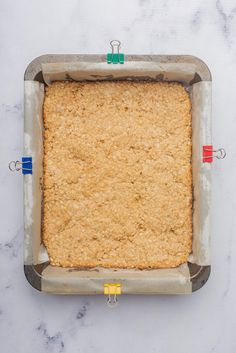 a square pan filled with food on top of a counter