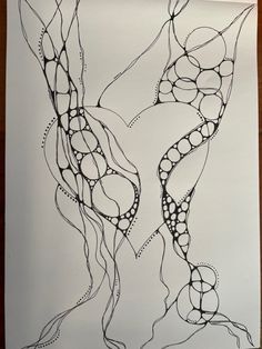 an artistic drawing on paper with lines and dots