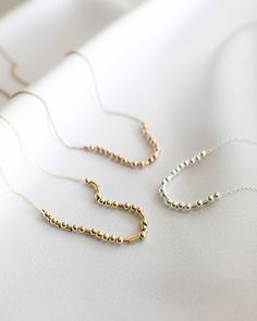 Our beaded, dainty Morse Code necklaces are a great way to carry your most special moments with you! These simple and minimal necklaces are made to suit anyone. O R D E R I N G 1. Select the options from the drop down box 2. Type your message in the personalization box 3. Add to cart C H A R A C T E R * L I M I T This style necklace can fit a maximum of 12 characters including spaces and symbols. A B O U T * T H I S * P I E C E This necklace is made with 14k gold or sterling silver beads, dainty Personalized Gold Beaded Necklace For Gift, Dainty Name Necklace With Letter Beads For Personalized Gift, Mom Morse Code Bracelet, Personalized Minimalist 14k Gold-filled Necklace, Mother's Day Dainty Gold-plated Name Necklace, Matching Couple Bracelets, Morse Code Necklace, Message Necklace, Personalized Couple Gifts