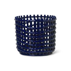 a large blue basket sitting on top of a white table