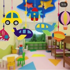 a child's playroom with toys hanging from the ceiling and on the floor