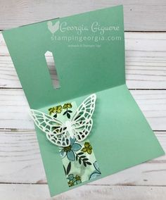 an open card with a butterfly on it