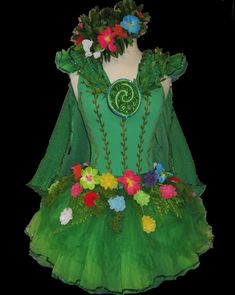 a green dress with flowers on it