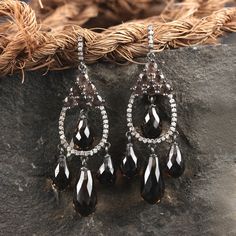 ❂ This earrings made with smoky quartz & diamonds in 925 sterling silver, ❂ Pave Diamond Gemstone Dangle Earrings 925 sterling Silver Jewelry. ❂ Gemstone Earrings, Smoky Quartz Earrings, Dangle Earrings, Diamond Earrings, Everyday Jewelry ❂ Special customize for Mother's day, Anniversary, Birthday Gift, Valentine, Christmas. ❂ Item Details: Gross Wt: 6.23 Grams 925 Sterling Silver Wt: 3.18 Grams Diamond Wt: 0.35 Carats Smoky Quartz Wt: 14.92 Carats Item Size: 44x16 mm Item SKU: AECO-2142 Gem Silver Diamond Gemstone Earrings For Evening, Elegant Brown Chandelier Earrings, Silver Gemstone Drop Diamond Earrings, Elegant Brown Evening Jewelry, Elegant Brown Earrings For Anniversary, Elegant Brown Drop Earrings, Elegant Brown Sterling Silver Earrings, Formal Brown Sterling Silver Earrings, Ear Wrap Earrings