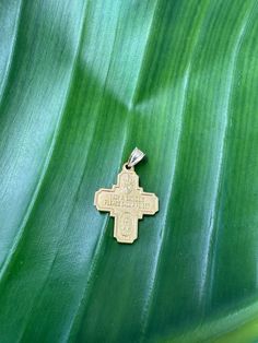 14k Cross Pendant This 14k Cross Pendant is a meaningful piece, measuring 28.2mm x 18.3mm and weighing 1.25 grams. It's a lightweight and versatile addition to any jewelry collection. This piece, like all our jewelry, is a unique find—once it's gone, it's gone—unlikely to be sourced again! Choosing this piece is a win-win: You'll stand out from the crowd & help the environment by shopping sustainably! Why You'll Love It: Meaningful Design: The cross inscription adds a personal and spiritual touc Spiritual 14k Gold Cross Pendant, 14k Gold Cross Pendant Spiritual Jewelry, Spiritual Cross Pendant In Tarnish-resistant Material, Spiritual Cross Pendant Jewelry, Tarnish Resistant, Spiritual Tarnish Resistant Cross Pendant Jewelry, Spiritual Tarnish-resistant Cross Pendant Jewelry, 14k Gold Crucifix Spiritual Jewelry, 14k Gold Spiritual Crucifix Jewelry, 14k Gold Spiritual Cross Jewelry