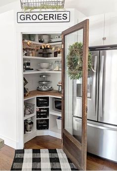 an open pantry in the middle of a kitchen with text overlay that reads groceries pantry for non food items