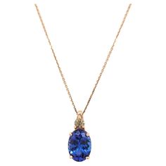 Beautiful 6.20 ct. tanzanite oval with 0.31 ct. champagne diamond rounds. Handmade in 14k rose gold. Length of chain is 18". Classic Oval Tanzanite Necklace, Yellow Gold Tanzanite Oval Necklace, Classic Oval Tanzanite Necklaces, Elegant Oval Tanzanite Necklaces, Elegant Tanzanite Oval Pendant Necklace, Gold Champagne, Champagne Diamond, Diamond Pendant Necklace, Champagne Gold