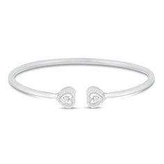 This charming bangle bracelet for her adds a touch of sparkle to her wrist and can be layered with other bracelets or worn alone. The sterling silver bangle features a heart-shaped design at each end, each shimmering in diamond accents. Valentine's Day White Gold Bangle, Anniversary Bangle Bracelet With Heart Charm, Elegant Adjustable Stackable Heart Bracelet, Silver Bangle For Anniversary On Valentine's Day, Valentine's Day Bangle Cuff Bracelet, Valentine's Day Heart Bangle Bracelet, Elegant Stackable Heart Bracelet, Heart Bangle Bracelet, Bracelet For Her