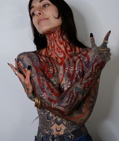 a woman with tattoos on her body and hands