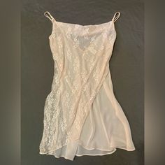 Pastel Peach Sheer Lace Nightgown/Slip In Size Large. Classically Feminine And Great Quality. Double Strapped With Tiny, Delicate Bows Where Straps Meet Gown. Straps Are Adjustable. It’s A Sheer Creamy Peach Gown With A Sheer Lace Wrapped Front In The Same Color. Has A Flattering Cowl Neckline. Bought And Never Worn. It Is In Great Condition. Sheer Fabric Is 100% Polyester While Lace Is 100% Nylon. It Is Machine Washable And Can Be Tumble Dried On Low. Please Feel Free To Message Me With Any Que Feminine Sheer Cami Sleepwear, Delicate Spring Sleepwear, Pink Delicate Lace Sleepwear For Summer, Delicate Summer Nightgown For Sleep, Delicate Summer Sleep Nightgown, Pink Delicate Lace Sleepwear, Feminine Sheer Sleepwear With Spaghetti Straps, Elegant Sheer Sleepwear, Pink Spaghetti Strap Chemise For Wedding Night