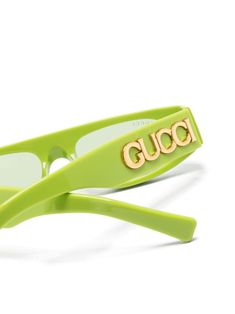 lime green acetate geometric frame green tinted lenses UV-protective lenses logo plaque at the arm straight arms and curved tips These glasses come with a protective case. Gucci Eyeglasses Women Green, Luxury Green Sunglasses With Uv Protection, Luxury Green Sunglasses With Square Frame, Luxury Green Sunglasses With Mirrored Lenses, Chic Rectangular Green Sunglasses, Chic Green Rectangular Sunglasses, Designer Green Sunglasses With Gradient Lenses, Luxury Green Polarized Sunglasses, Trendy Green Square Frame Sunglasses