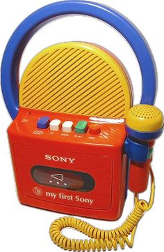 an orange and blue toy radio next to a yellow cord on a white background with the words my first sony