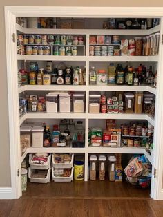 an organized pantry with lots of food in it