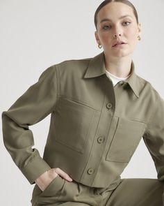 A flattering fit makes our Stretch Crepe Cropped Jacket an ideal topper whether you’re wearing a dress or looking to elevate a more casual jeans-and-a-tee ensemble. Made with recycled polyester with just the right amount of stretch it feels easy and effortless. Pairs perfectly with our Stretch Crepe Pleated Wide Leg Pant or Stretch Crepe Pleated Ankle Pant.  | Quince | Women's Stretch Crepe Cropped Jacket in Olive, Size XS, Recycled Polyester / Spandex Spring Utility Jacket For Workwear, Khaki Long Sleeve Cropped Jacket For Work, Chic Khaki Cropped Long Sleeve Jacket, Chic Khaki Cropped Jacket For Work, Chic Relaxed Fit Utility Jacket For Work, Versatile Cropped Jacket For Fall Workwear, Fitted Utility Jacket For Workwear In Fall, Versatile Khaki Tops For Work, Solid Cropped Outerwear For Work