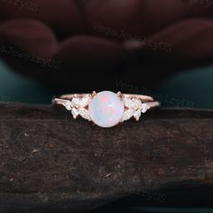 Vintage Opal engagement ring Unique rose gold opal engagement ring dainty bridal ring Marquise moissanite ring promise ring Anniversary gift ● Ring information: --main stone: Natural Opal --stone size & shaped: 6.5mm & round --side stones: Moissanite or Diamond --side stone weight: about 0.28ct ● Optional service: --personalized order --rush order & overnight --installment --engraving --gift box Please consult us for details ● Production and shipping time: We usually make the ring and arrange th Opal Engagement Ring Simple, Non Traditional Engagement Rings Opal, Opalite Engagement Ring, Dainty Rose Gold Opal Ring For Wedding, Dainty Rose Gold Opal Wedding Ring, Dainty Opal Ring For Wedding With Round Cut, Rose Gold Opal Ring With Prong Setting, Simple Opal Ring, Boho Vintage Engagement Ring