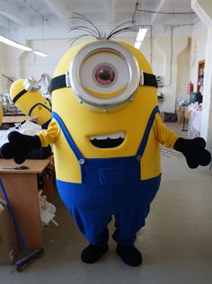 a person in a yellow and blue minion costume