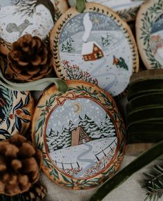 christmas cookies decorated with designs and pine cones