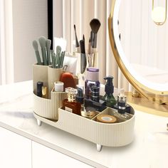 a vanity drawer with makeup and cosmetics in it