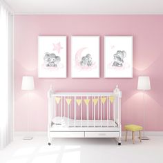 a baby's room with pink walls and two pictures above the crib, along with a yellow stool