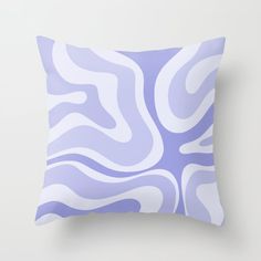 a purple and white pillow with wavy lines