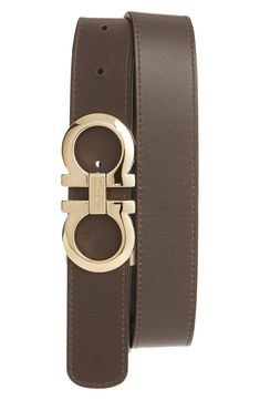 A removable double-Gancio buckle adds golden sheen to a handsome belt crafted from high-quality leather. 1 1/4" belt width; 3 1/2" x 1 3/4" buckle Leather Made in Italy Ferragamo Men, Men Shirt, Leather Belts, Black Belt, High Quality Leather, Salvatore Ferragamo, Belt Buckles, Leather Belt, Leather Watch