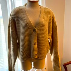 Fun Oversized Cardigan To Top Off Your Look. Cozy V-neck Outerwear For Day Out, Cozy Cream V-neck Outerwear, Beige Button-up Cozy Cardigan, Cozy Beige Button-up Cardigan, Cozy Beige Button-up Sweater, Cozy Oversized Cardigan For Day Out, One Size V-neck Cardigan For Day Out, Oversized Beige Cardigan For Day Out, Casual Beige Cardigan For Cold Weather