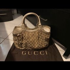 Reposhing This Item I Purchased From @Dhada1988. Loved It, But Never Used It. The Bag Is In The Exact Condition As Pictures. It’s A Beautiful Purse But I Like My Bags To Fit Comfortably Over My Shoulder And This Bag Is More Of A Handbag.. Designer Gucci Gold Bags, Gold Gucci Bag For Shopping, Gucci Gold Bag With Dust Bag, Gucci Gold Shopping Bag, Gucci Gold Monogram Canvas Bag, Gold Gucci Shopping Bag, Gucci Gold Tote Shoulder Bag, Gucci Gold Tote Bag, Gold Gucci Tote Bag