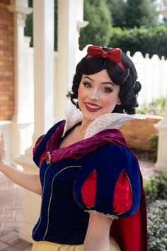 a woman dressed as snow white posing for the camera