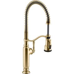 a kitchen sink faucet with a brass finish