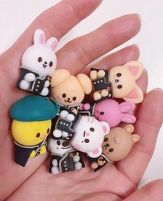 there are many small toy animals in the hand