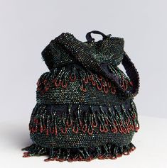 Victorian Edwardian Beaded Drawstring Reticule - Women's small handbag, netted with a drawstring and decorated with iridescent beading. Materials: Silk cord crochet netting, Glass Beading Brand/Maker: Unknown Era: 1900s 1900s Victorian Drawstring Purse, Beaded Handbag, Black Shimmer, Evening Bag, Drawstring satchel style Peacock Iridescent Green beads with Copper claret beaded tips. Beads are affixed on a fine Silk cord knitted base and looped fringe covers the sides. No lining, Very delicate (p Crochet Netting, Beading Materials, Cord Crochet, Period Piece, Bead Tips, Drawstring Purse, Beaded Evening Bags, Iridescent Green, Styles P