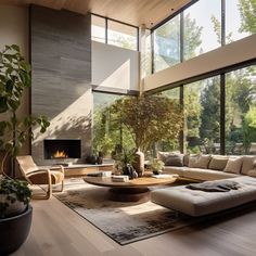 a living room filled with furniture and a fire place in the middle of a floor to ceiling window