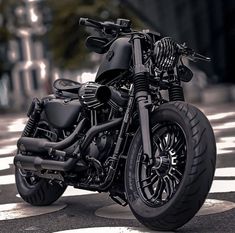 a black motorcycle is parked on the street