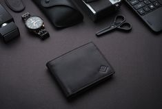 Buy one get one free surprise gift 🎁  Genuine Leather Wallet, Engraved Dad Gift Men's Wallet, Bifold Wallet, Men's Wallets, Groomsman Wallet, Men's Custom Wallet Gift for him Looking for a pocket friendly yet luxurious brand? Elitaria is the right choice. Our products are designed to meet all your expectations and enhance the prevailing elegance in you, and suits for all your occasions. TYLISH, SPACIOUS, SAFE and SENTIMENTAL. With handcrafted exquisite top-grain leather Specifications: Standard Bifold Wallet Usage: Daily Style: Minimalistic / Normcore Main Material: Top Grain Cow Leather Lining Material: Polyester Colors: Black Size (cm): 11 cm x 8.5 cm x 02 cm Delivery: 3 to 5 days Features:  06 Credit Cards Slots 02 Cash Compartment 01 ID Card Pocket 02 Visiting Cards Pockets Additional Black Trifold Wallet With Rfid Blocking As Gift, Black Bifold Wallet For Personalized Gift, Personalized Black Bifold Wallet, Custom Black Handmade Trifold Wallet, Modern Black Leather Trifold Wallet, Black Leather Wallet Hand-stitched, Custom Wallet, Luxury Wallet, Genuine Leather Wallets