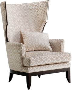 an upholstered chair with pillows on the back and armrests is shown in front of a white background