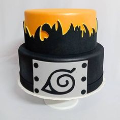 a black and yellow cake with flames on it