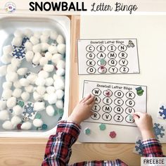 a child is playing with snowball letters and numbers in the winter themed letter recognition game