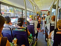 many people are riding on the bus together