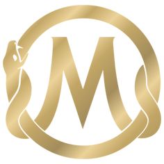 the letter m in a gold circle