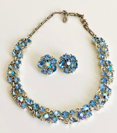 "Vintage LISNER Baby Blue Rhinestones Earring and Chocker Necklace Set in excellent vintage condition, marked Lisner.  Measures  Choker 17\" long by .5\"  wide  Earrings 1\" in diameter  All items come from a smoke and pet free home.   Please note! We endeavor to make our customers as happy as possible. This item is Vintage and we do our best to describe items as accurately as possible.   We are happy to combine shipping on multiple purchases! Just email me and let me know you are still shopping Blue Costume Jewelry For Anniversary, Vintage Blue Jewelry For Party, Vintage Crystal Jewelry With Matching Earrings, Vintage Blue Jewelry For Wedding, Vintage Light Blue Jewelry For Wedding, Vintage Blue Wedding Jewelry, Light Blue Vintage Wedding Jewelry, Vintage Blue Necklace For Anniversary, Vintage Light Blue Wedding Jewelry