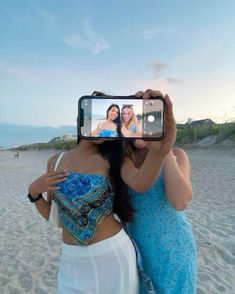 two women taking a selfie on the beach