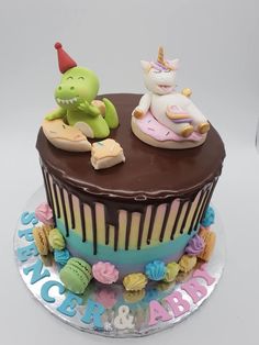 a birthday cake with chocolate frosting and decorations