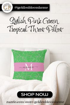 a white chair with a green and pink pillow on it