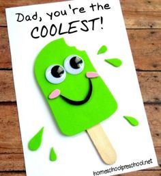 a green popsicle with googly eyes and the words dad you're the coolest on it