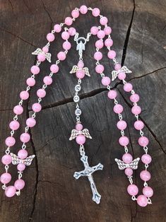 This Rosary is a handmade Traditional Catholic Rosary. This Rosary is made with 6mm cat eye, cats eye pink Beads that shimmer in light. This Rosary is made with stainless steel and silver plated Findings, Angel Our Father Beads, a traditional Catholic Centerpiece and a traditional Catholic Crucifix. This Rosary is made the traditional chain Catholic way, each Bead is hand Beaded and chained, which makes the Rosary strong and very sturdy. It's made with Stainless steel findings, silver plated Fin Catholic Crucifix, Catholic Rosary, Our Father, The Rosary, Dope Jewelry, Rosary Catholic, Cats Eye, Rosary Beads, Catholic Gifts