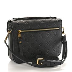 This is an authentic LOUIS VUITTON Empreinte Pochette Metis in Black. This stylish shoulder bag is crafted of classic monogram embossed calfskin leather in black. The bag features a leather top handle, an adjustable leather shoulder strap, and polished brass hardware. The envelope-style crossover flap opens to a gray striped fabric interior. Pochette Metis Black, Classic Monogram, Louis Vuitton Empreinte, Stylish Shoulder Bag, Striped Fabric, Striped Fabrics, Brass Hardware, Polished Brass, Leather Top